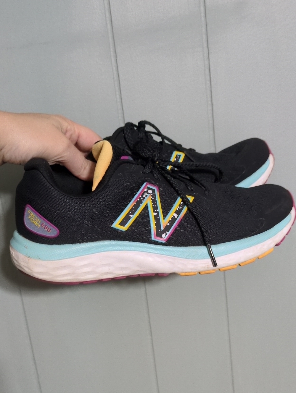 New Balance Women's Black Running Shoes with Blue and Yellow Accents